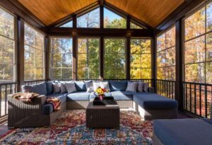 New Modern Screened Room with Patio Furniture, Summertime Woods in the Background 